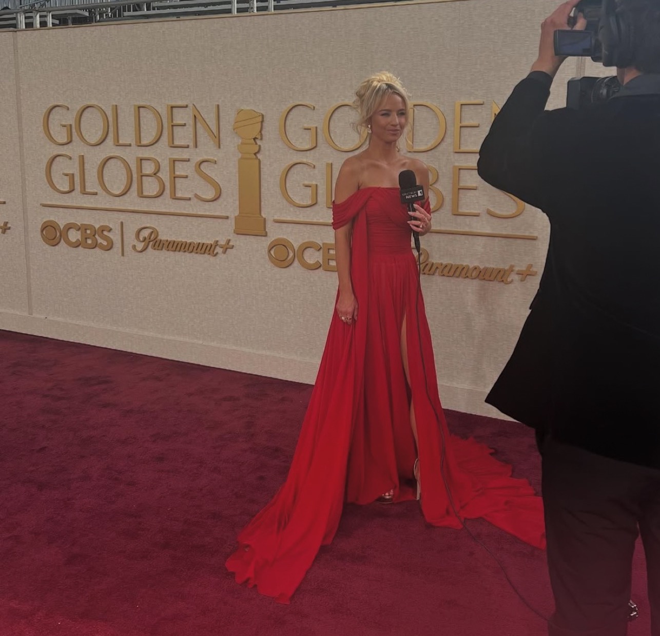 Nikki Kay on the Golden Globes red carpet in a red gown